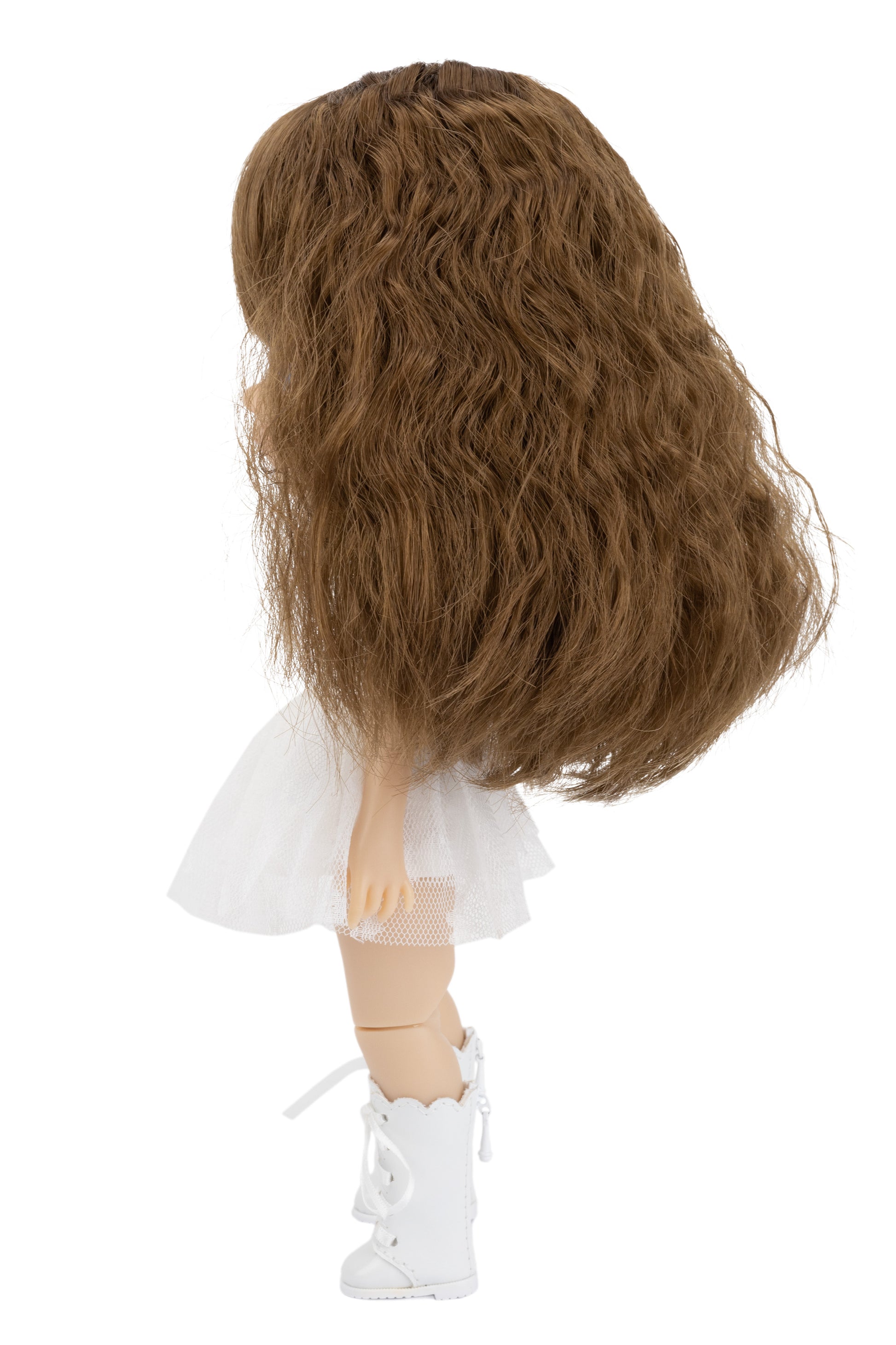 Doll with long brown hair, white dress, and white shoes on a white background