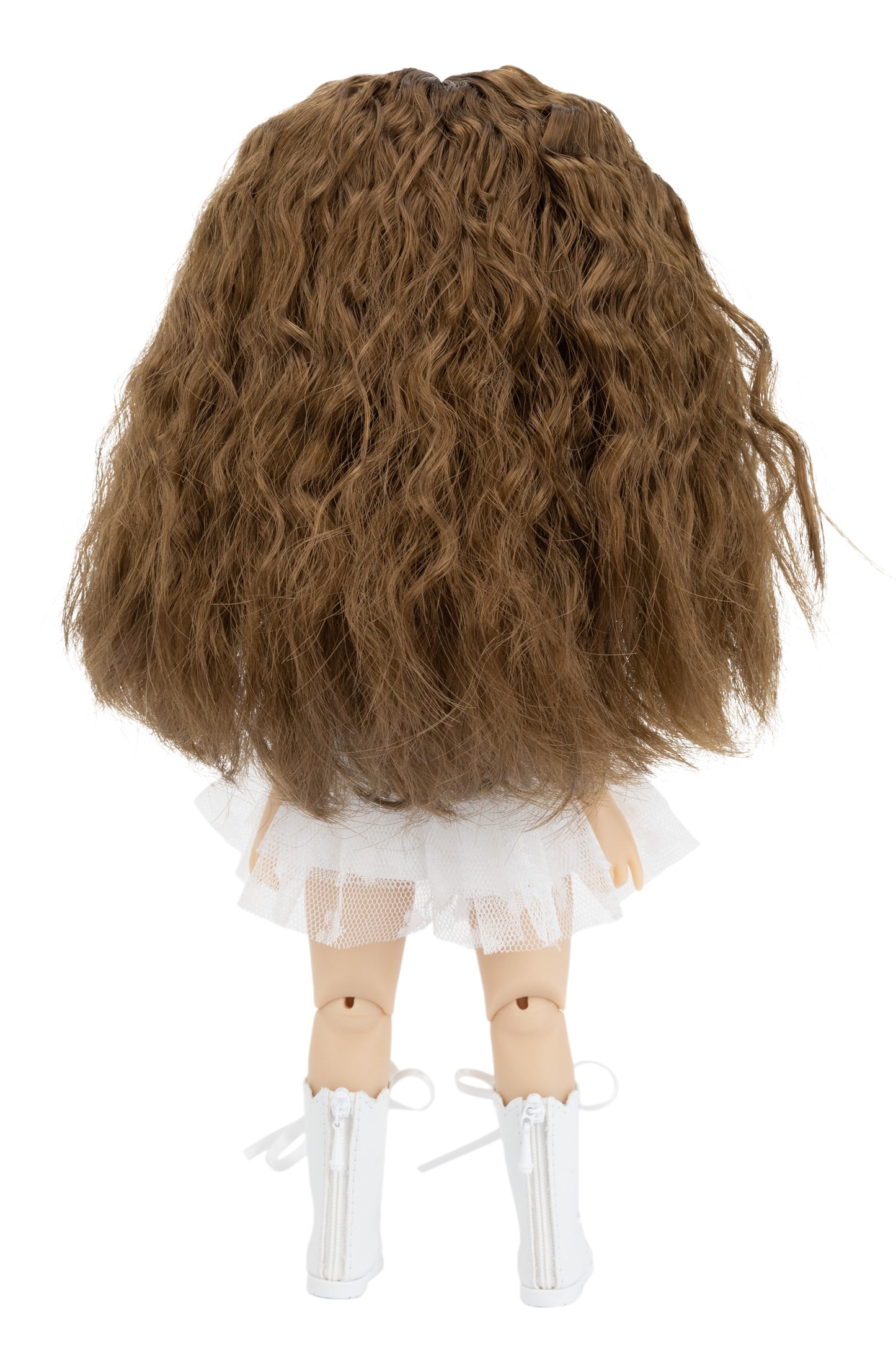 Doll with long brown hair and a white outfit on a white background