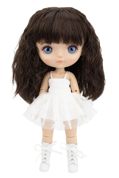 Doll with long dark brown hair, blue eyes, and a white dress on a white background