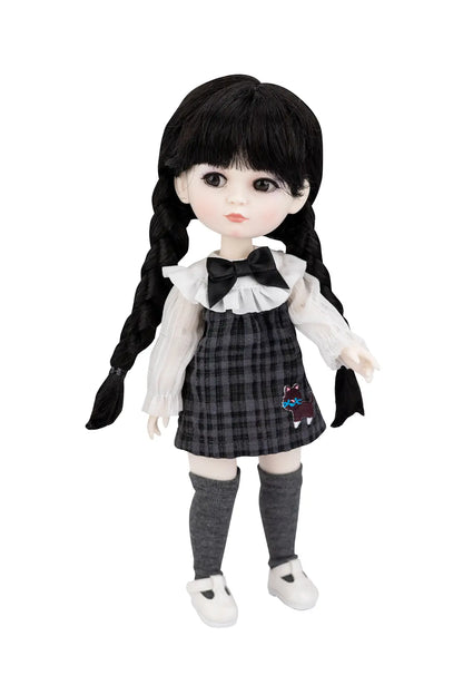 A gothic-style doll with long black braided hair, wearing a black and gray plaid dress over a white ruffled blouse, with gray socks and white shoes, set against a plain white background.