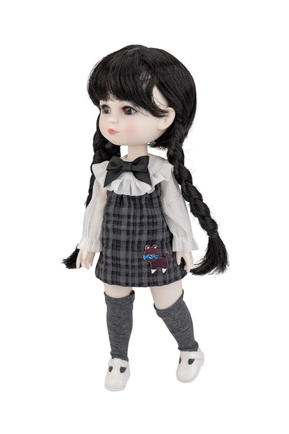 A  collectible doll with long black braided hair, wearing a gray and black plaid pinafore dress over a white ruffled blouse, gray knee-high socks, and white shoes, photographed against a solid white background.