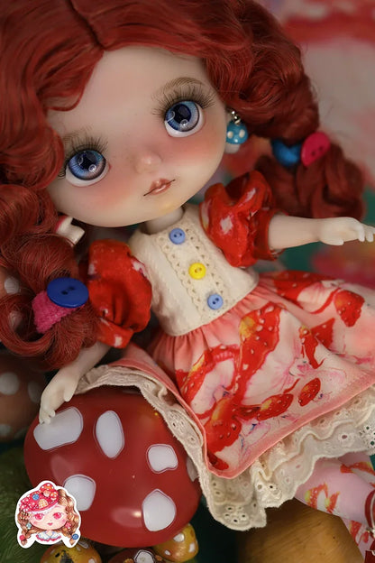 Mori_Lolli_Mushroom_Fantasia Doll with red hair and colorful outfit on a blurred background