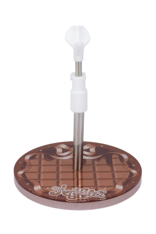 A chocolate-themed stand or display base with a round brown base printed like a chocolate bar, a vertical metal rod, and a white plastic top knob, shown on a plain white background.