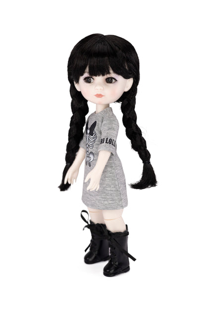 Doll with black hair styled in pigtails, wearing a gray dress and black boots on a white background