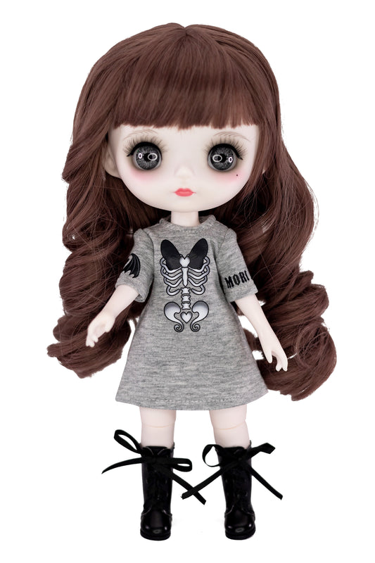 Doll with long brown hair wearing a gray dress with a skeleton design on a white background