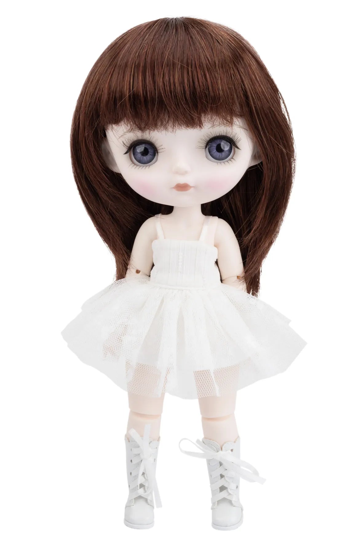 Doll with brown hair, white dress, and white shoes on a white background