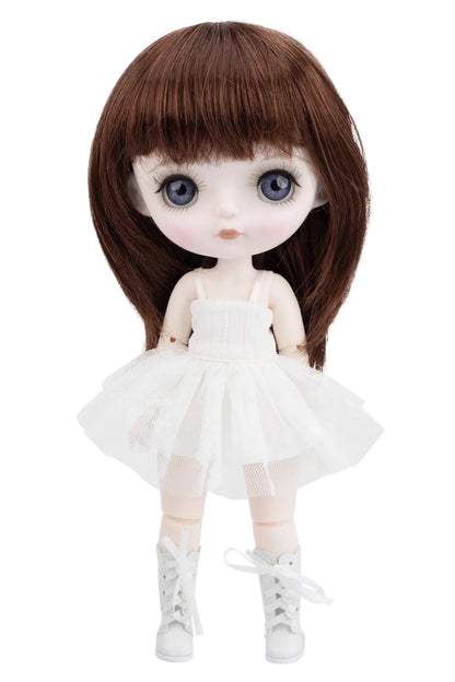 Doll with brown hair, white dress, and white shoes on a white background