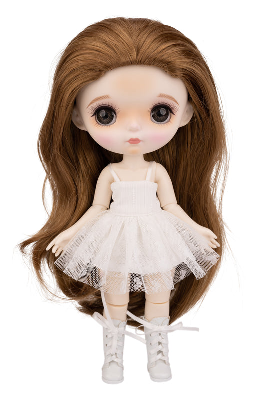 Doll with long brown hair wearing a white dress on a white background