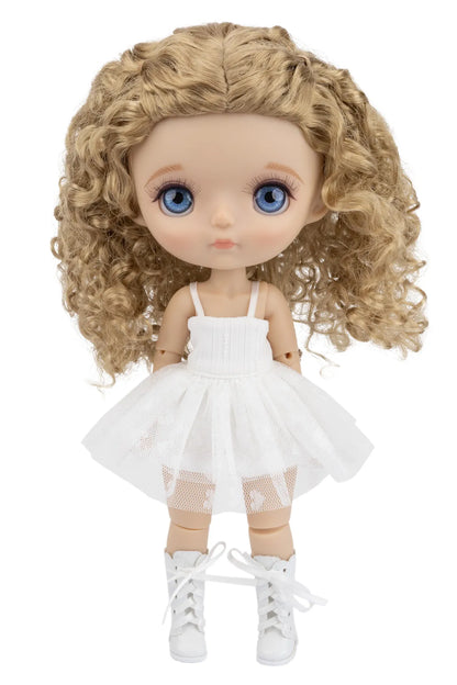 Doll with blonde curly hair and blue eyes wearing a white dress on a white background