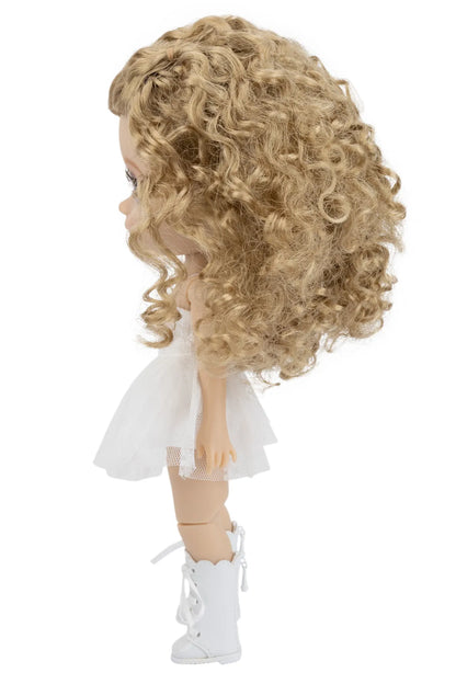 Doll with blonde curly hair wearing a white dress and shoes on a white background