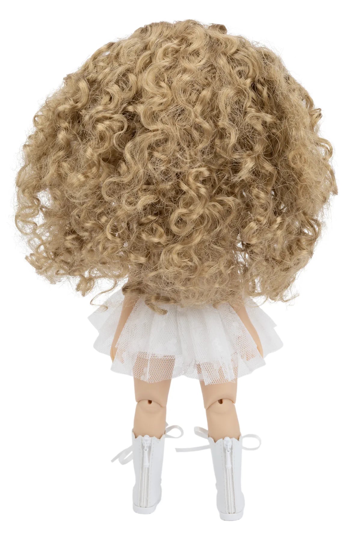 Doll with blonde curly hair wearing a white dress on a white background
