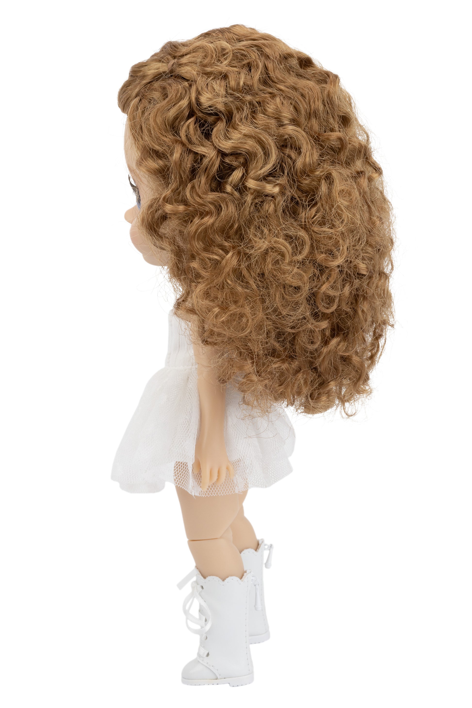 Doll with curly brown hair, white outfit, and white boots on a white background