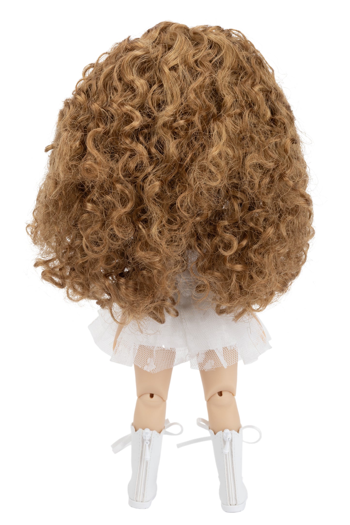 Doll with curly brown hair and white outfit on a white background