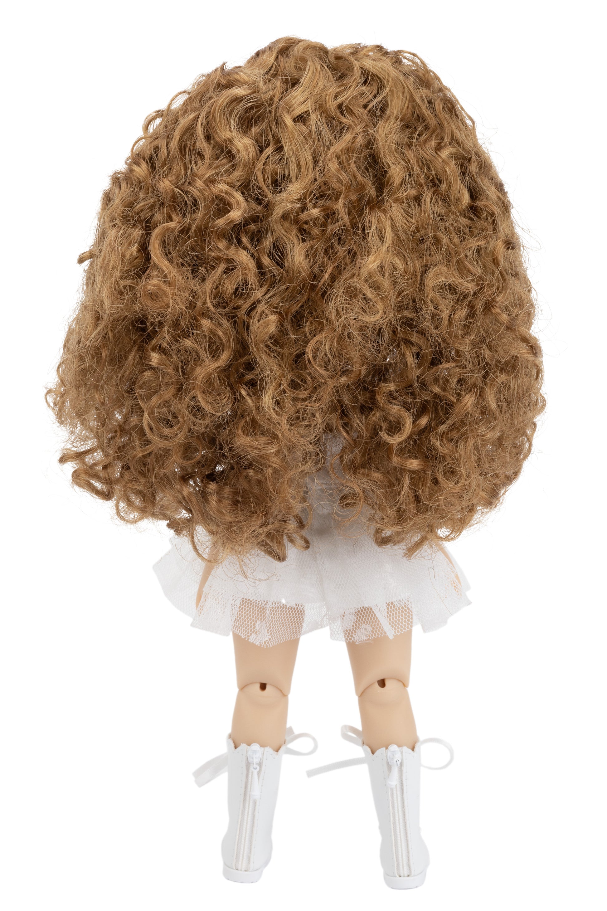 Doll with curly brown hair and white outfit on a white background