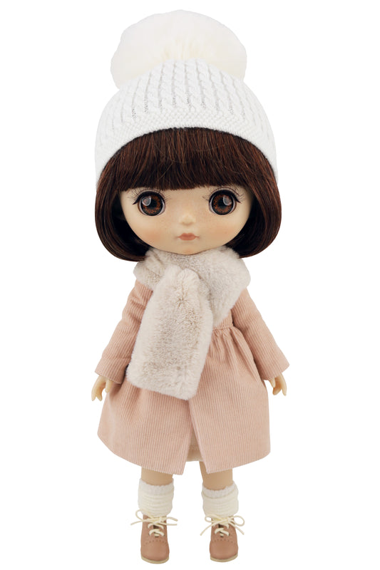 Doll wearing a white knit hat, pink coat, and beige scarf on a white background